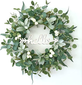 TOKCARE eucalyptus wreath with hello sign on front door, welcoming guests beautifully.