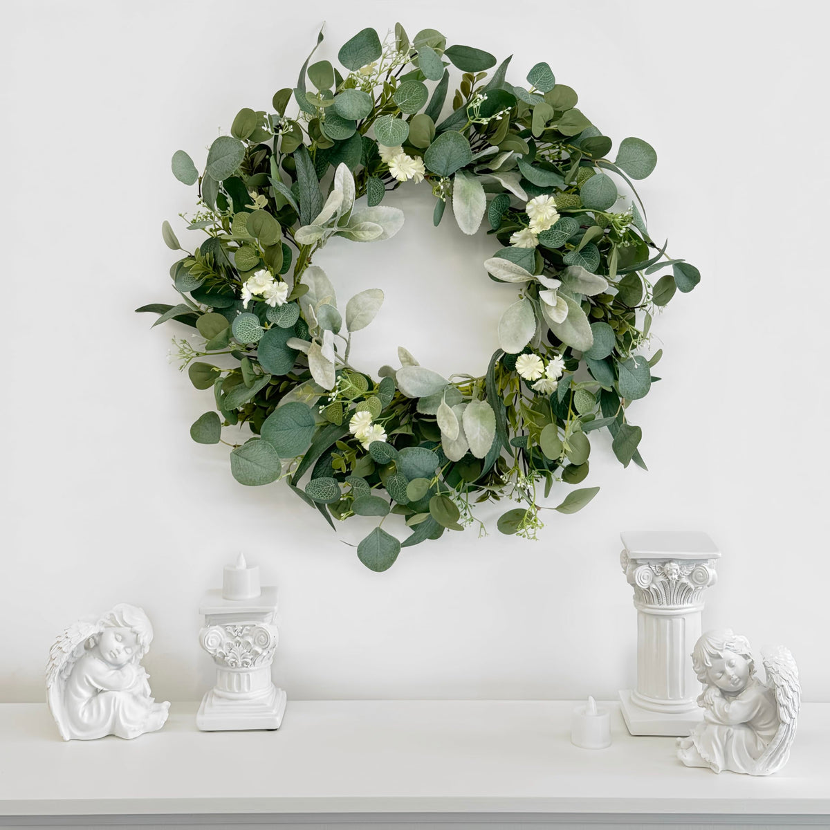 TOKCARE eucalyptus wreath with multi-textured foliage adds depth to any wall.