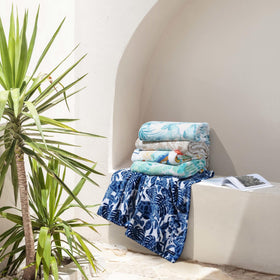 Tommy Bahama Turtle Bay Blue throw in living room complements casual lounging.
