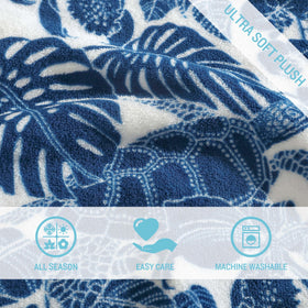 Tommy Bahama Turtle Bay Blue throw wrapped around shoulders offers versatile warmth.