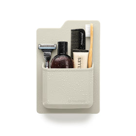 TOOLETRIES James organizer demonstrates silicone grip on bathroom surface for secure storage.