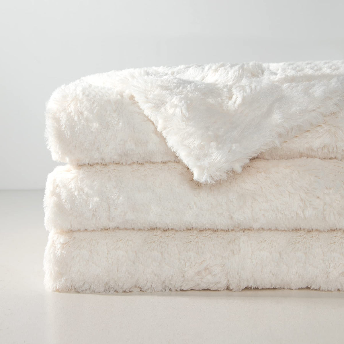 TOONOW double-side cream throw blanket shown on a chair for versatile use.