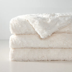 TOONOW double-side cream throw blanket shown on a chair for versatile use.