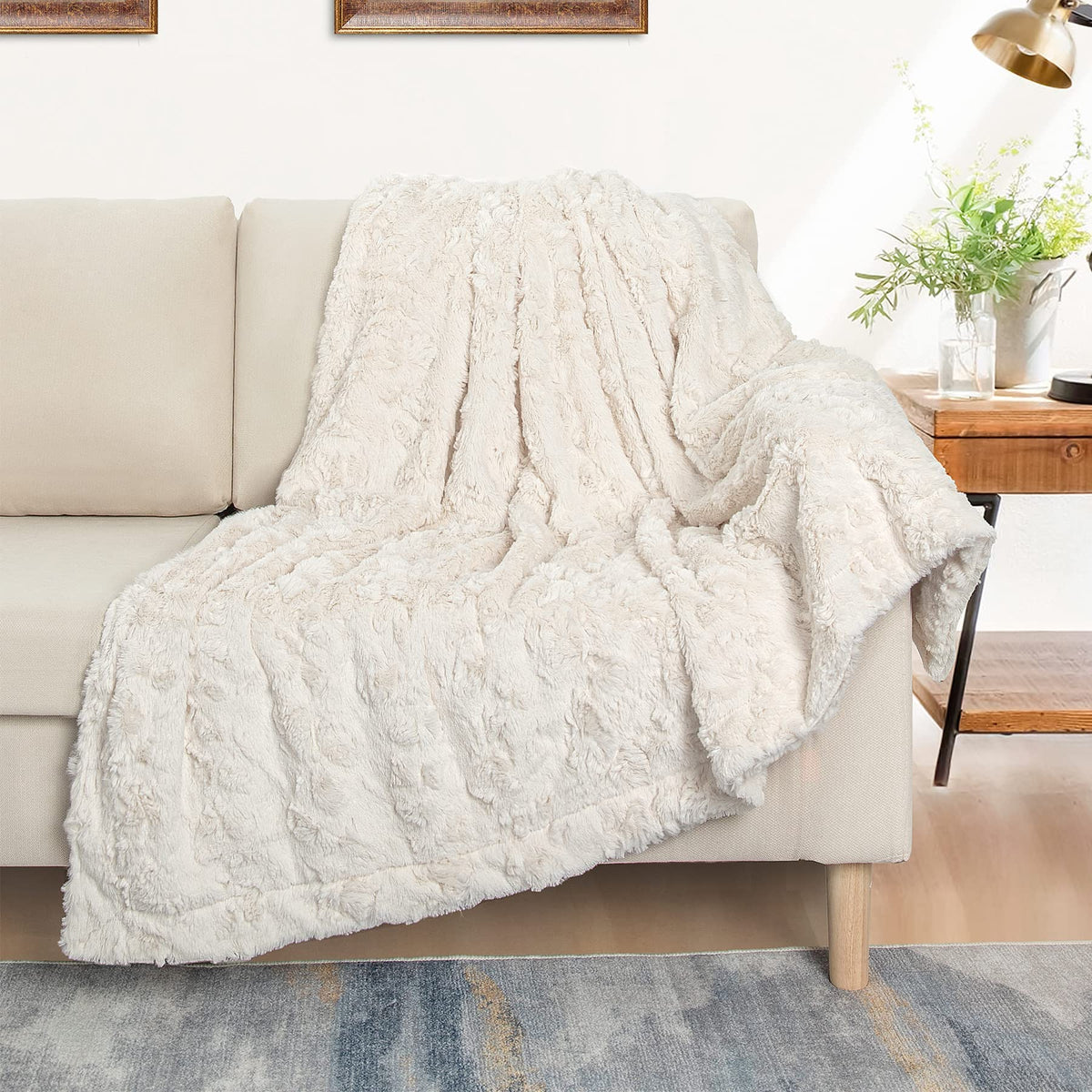 TOONOW machine-washable cream throw blanket with easy care features.