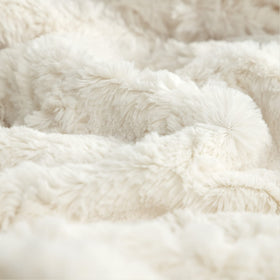 TOONOW cream throw on a sofa creates a cozy ambiance for movie nights.