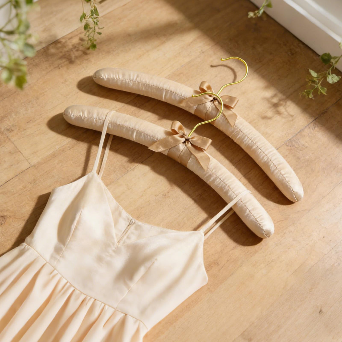 TOPIA HANGER champagne gold finish enhances wardrobe aesthetics with a luxe look.