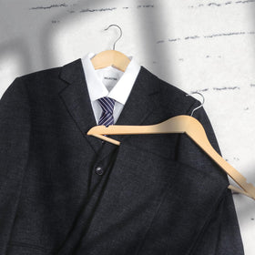 TOPIA HANGER sturdy maple wood supports heavy garments.