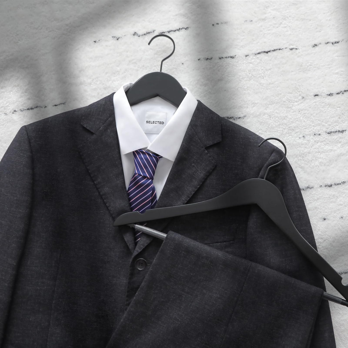 TOPIA HANGER notches precisely cut prevent camisoles from slipping off.