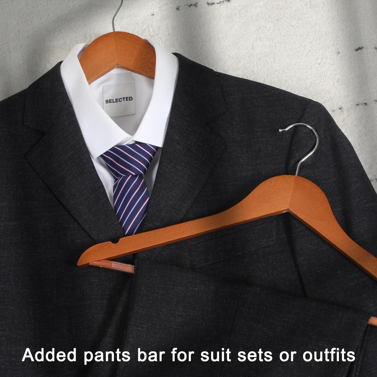 TOPIA HANGER smooth matte walnut finish protects clothes from scratches.