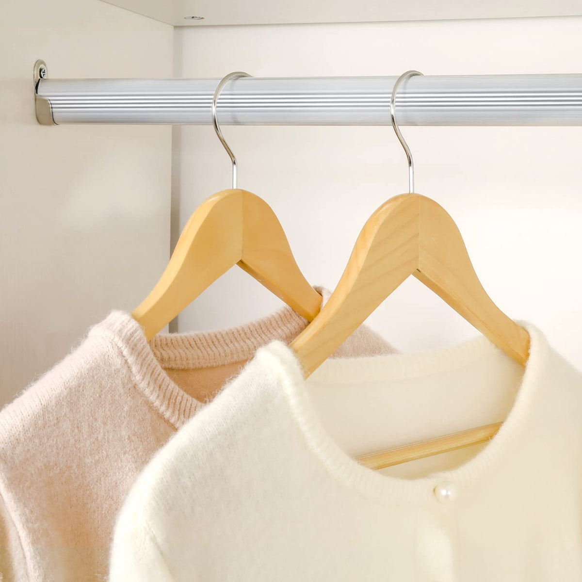 TOPIA HANGER smooth-sanded finish protects fabrics and preserves wood grain.