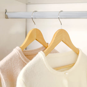 TOPIA HANGER smooth-sanded finish protects fabrics and preserves wood grain.