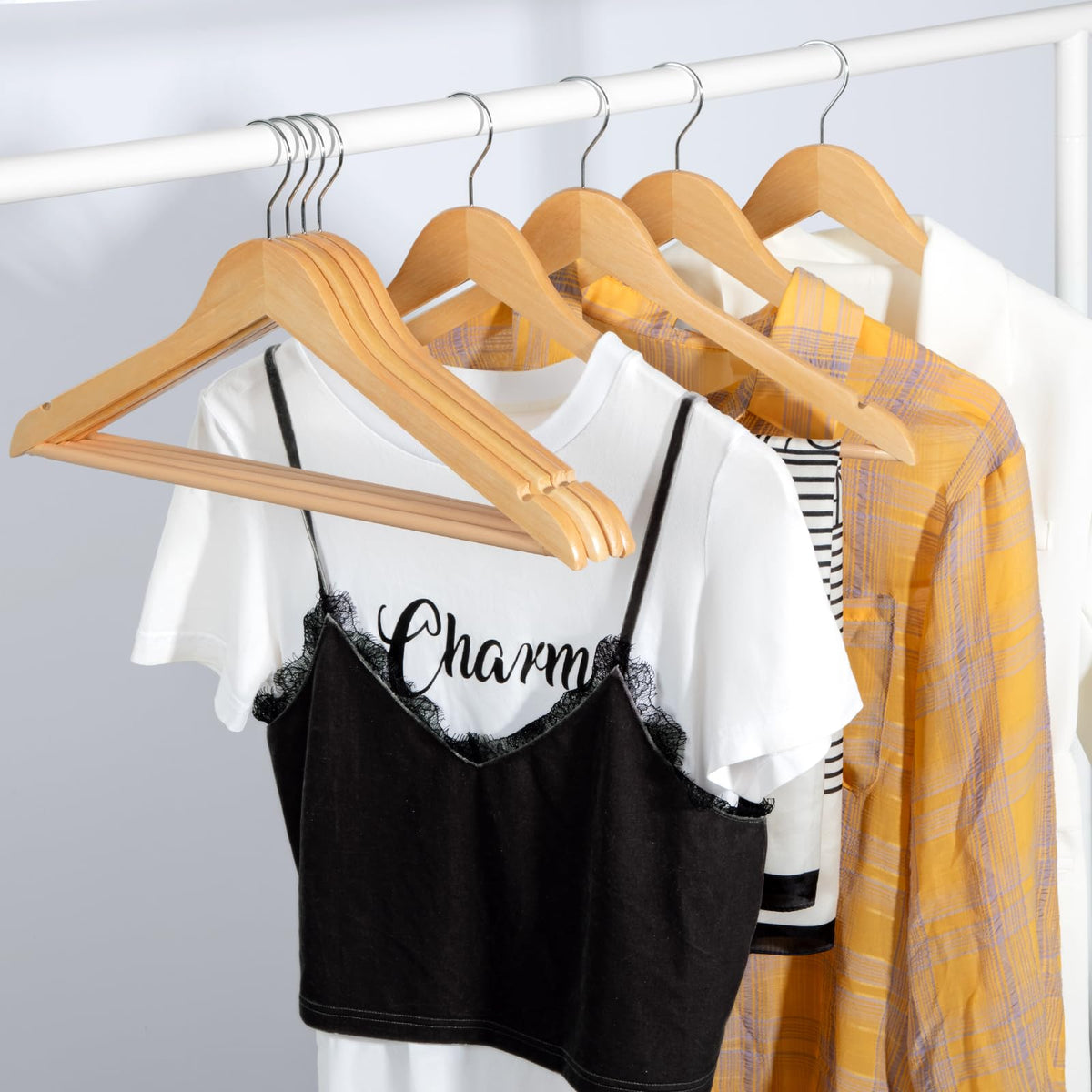 TOPIA HANGER notches accommodate camisoles and strap garments securely.