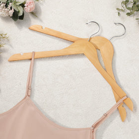 TOPIA HANGER lacquered natural wood finish complements any closet style