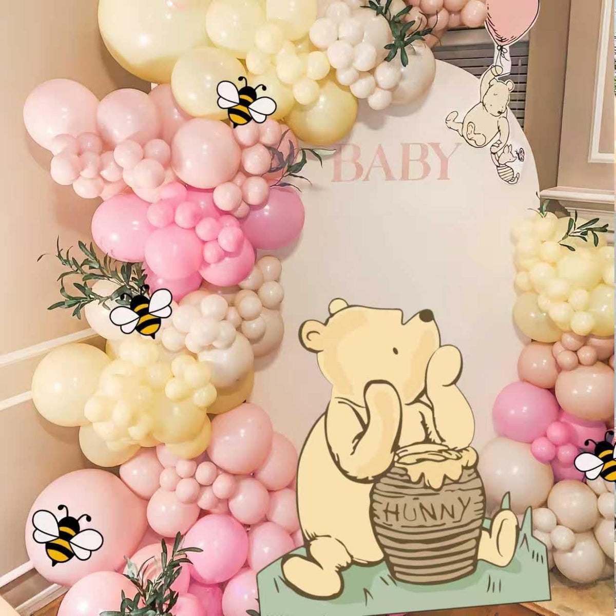 TopJianyu Winnie cutout on a stand creates a striking photo backdrop for baby showers.