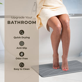 TOSORO Stone Bath Mat showing rubber backing and added stability on wet floors.