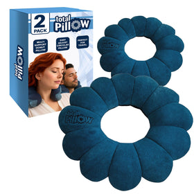 Total Pillow donut pillow on an airplane, offering neck and head support for flight comfort