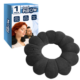 Total Pillow donut pillow on airplane seat for adaptable neck support and comfort.