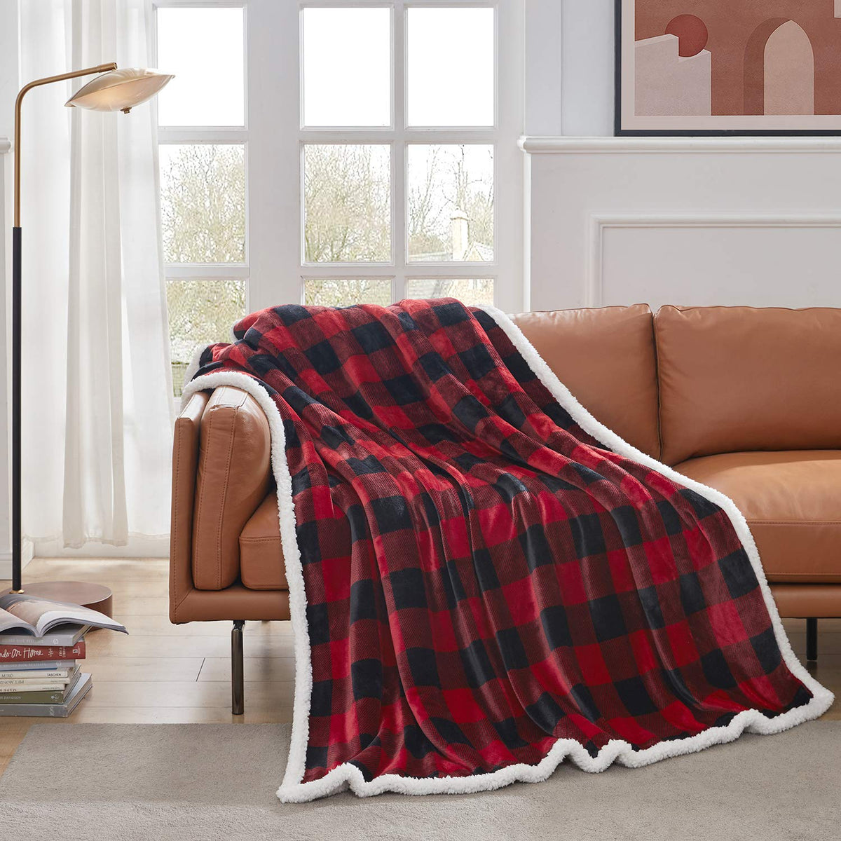 Touchat fleece-plush blanket draped on a couch for cozy evenings.