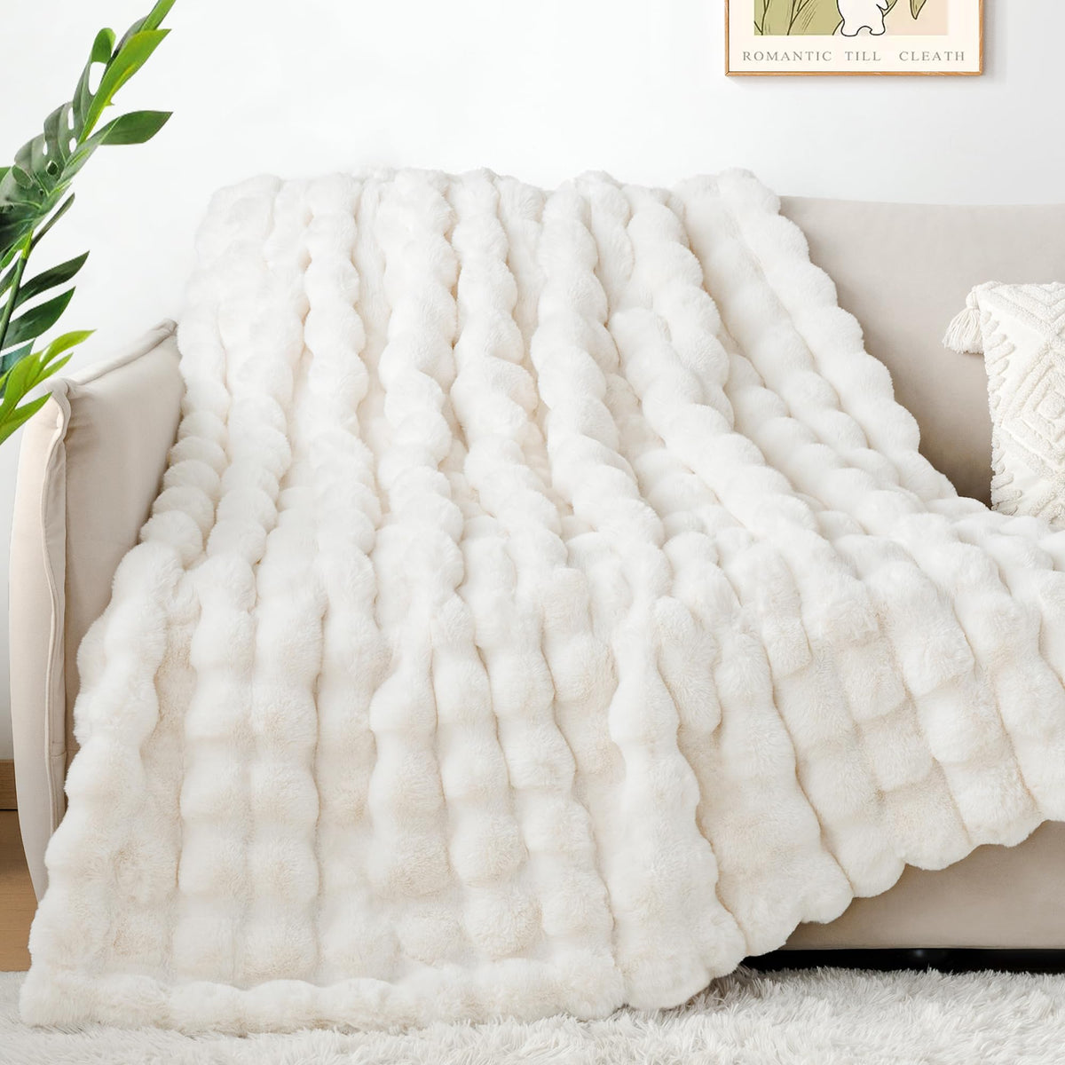 Touchat luxury faux rabbit fur throw draped on bed creates luxe texture and warmth