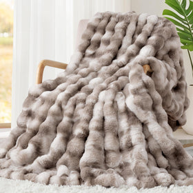 Touchat Luxury 1000GSM faux rabbit fur throw offers plush couch comfort.
