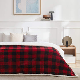 Touchat plaid blanket on a bed demonstrating easy-care all-season use.