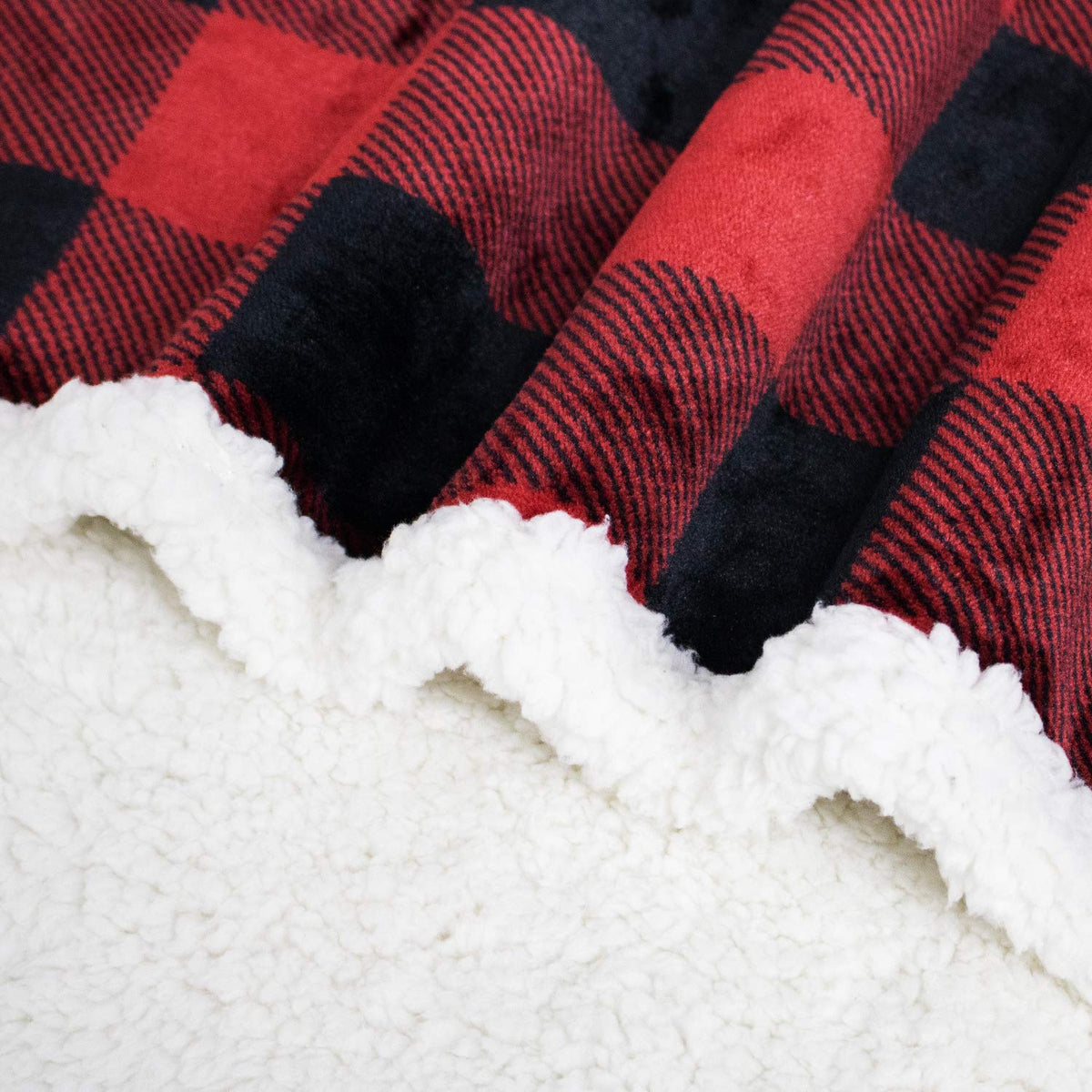 Touchat plaid blanket outdoors, ideal for camp or picnics.