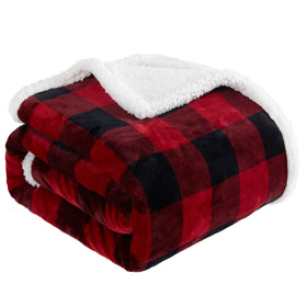 Touchat sherpa-plaid blanket on a sofa for cozy lounging.
