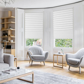 Touri pleated blackout blind rolled demonstrates compact, light-filtering design.