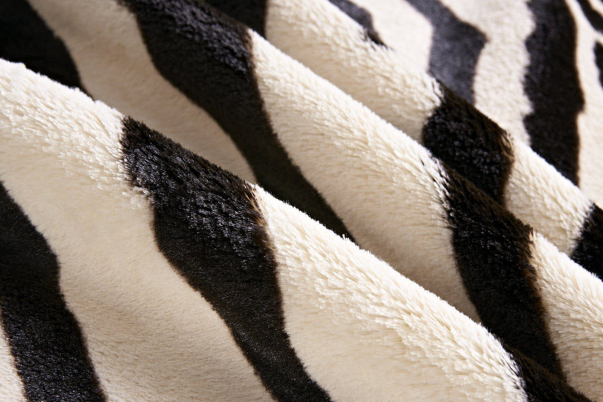 Townssilk Area Rug cream faux zebra modern living pairing with wood floors elevates room aesthetics