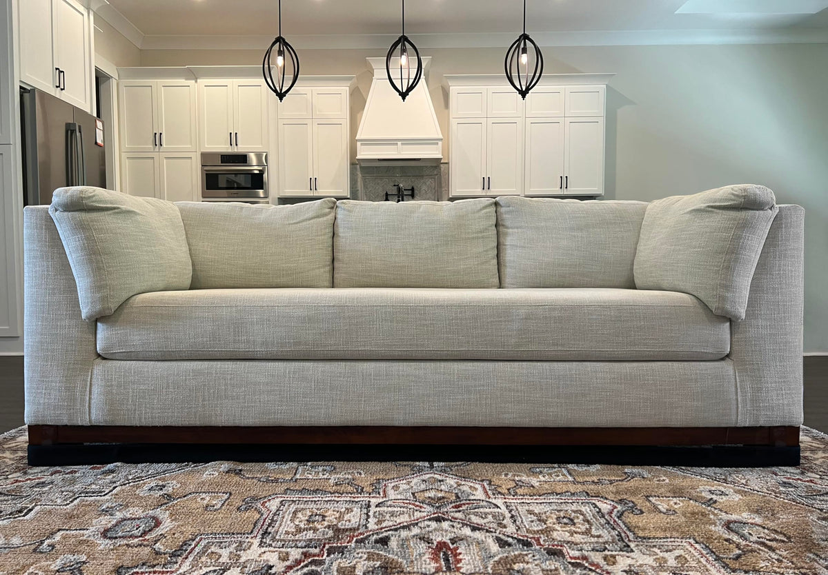 TOY BLOCKER discreet black fabric blends with furniture and floor.
