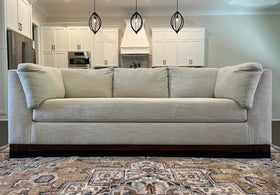 TOY BLOCKER discreet black fabric blends with furniture and floor.
