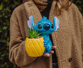 Toynk pineapple planter with Stitch creates a cheerful island vibe.