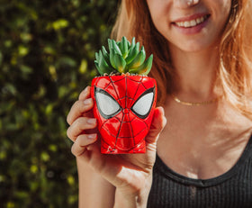 Toynk Spider-Man Marvel collectible planter displayed with other figures.