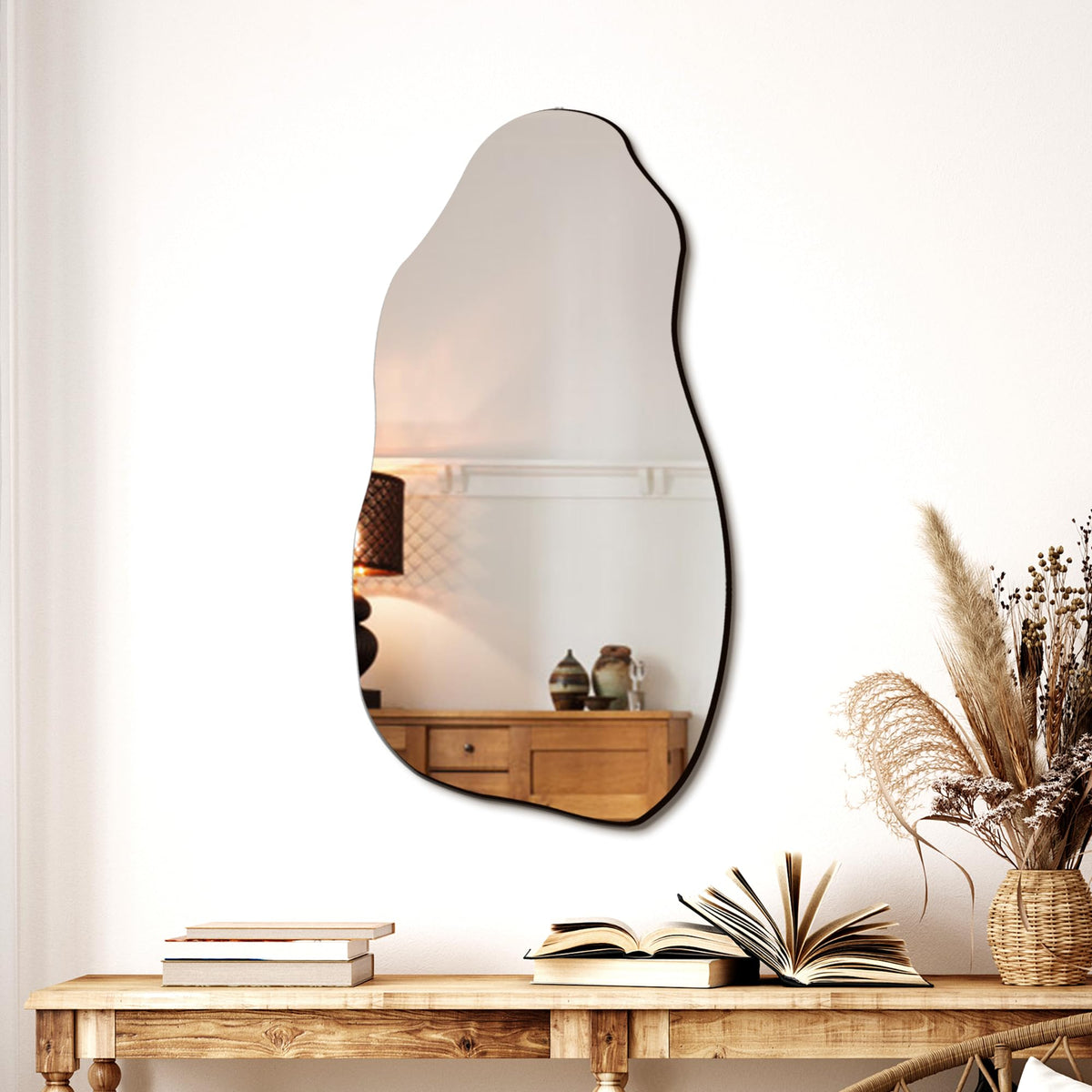 TRAHOME irregular wall mirror serves as a living room focal point.