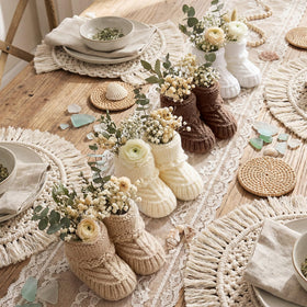 Tranquun baby booties centerpiece in white for elegant gender reveal décor.