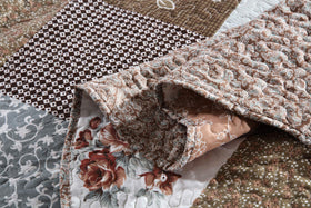 Travan quilt set with shams arranged for a complete bedding update