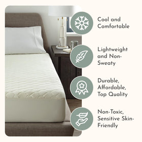 Treescend organic mattress protector with deep-pocket fit secures the mattress overnight.
