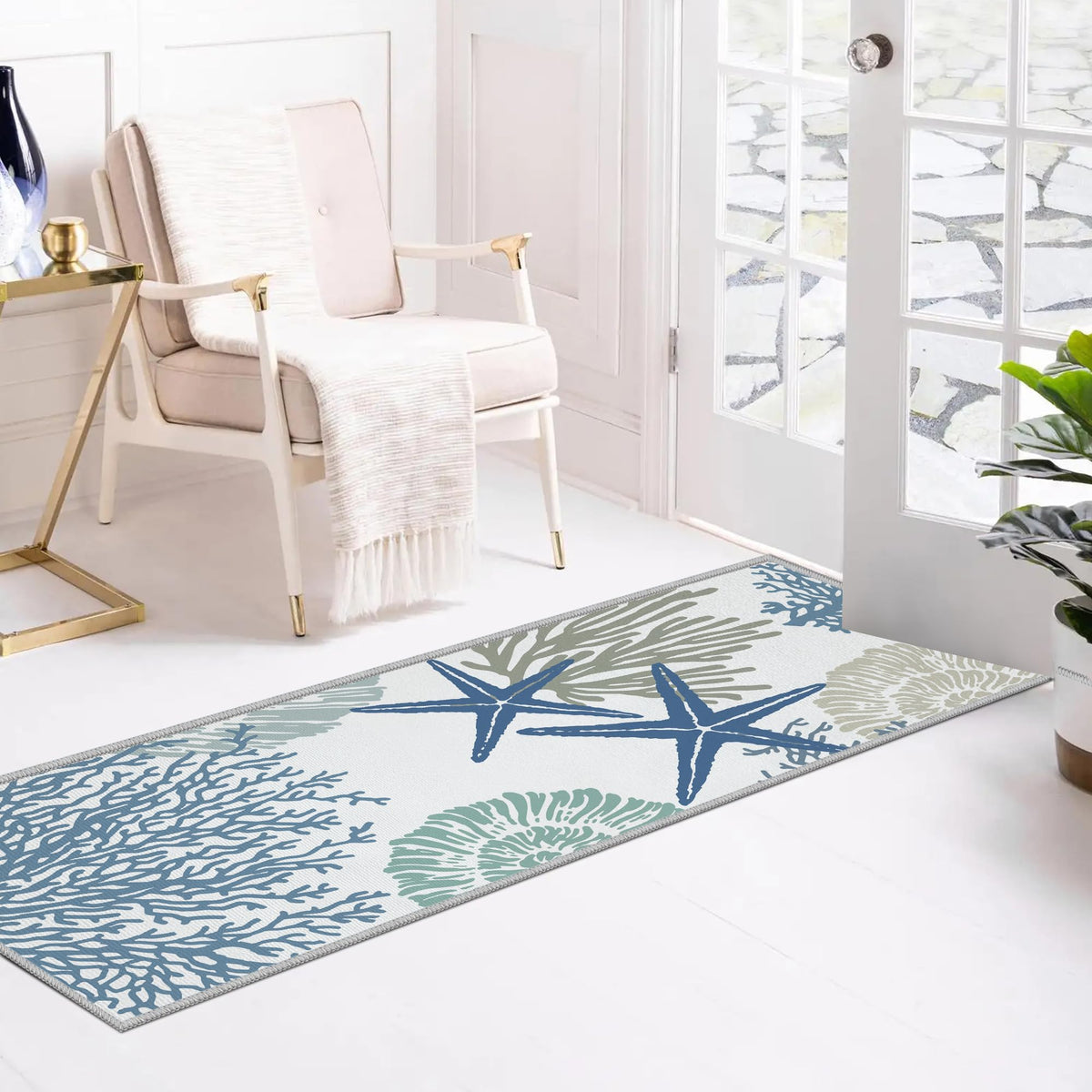 Tritard blue coral motif rug enhances entryways with subtle nautical flair.