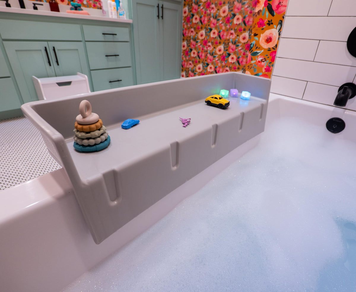 Tub Topper splash guard with suction cups keeps water in the tub