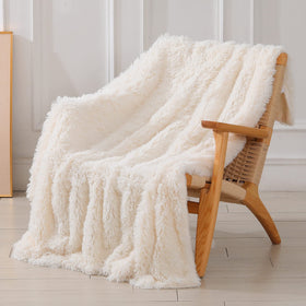 Tuddrom decorative soft fuzzy throw blanket in cream adds cozy living room style