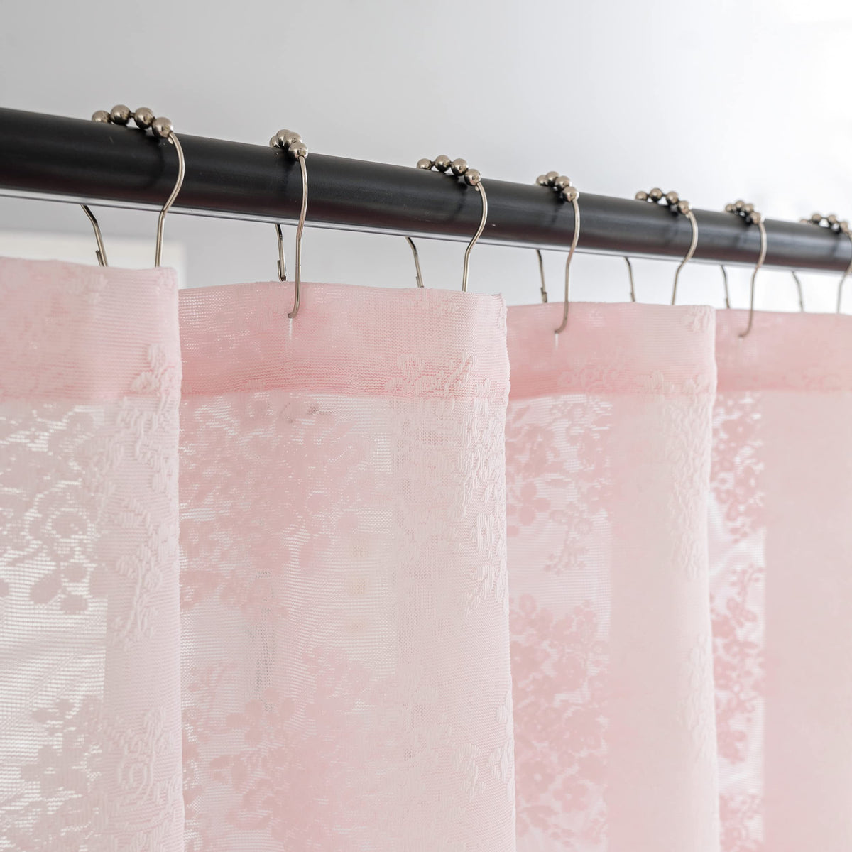 TUDECO lace pattern closeup showcases delicate floral detailing for feminine bathroom decor.