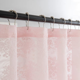 TUDECO lace pattern closeup showcases delicate floral detailing for feminine bathroom decor.