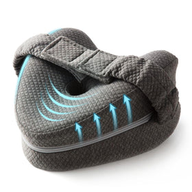 TULARIS memory foam knee pillow between legs with adjustable strap for side sleeping comfort.