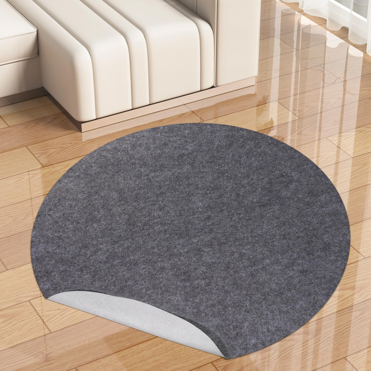 TUOTPE round 5ft rug pad with waterproof top layer keeps rugs secure on hard floors.