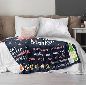 Turelos 60x50in kdrama blanket displayed on bed and sofa.