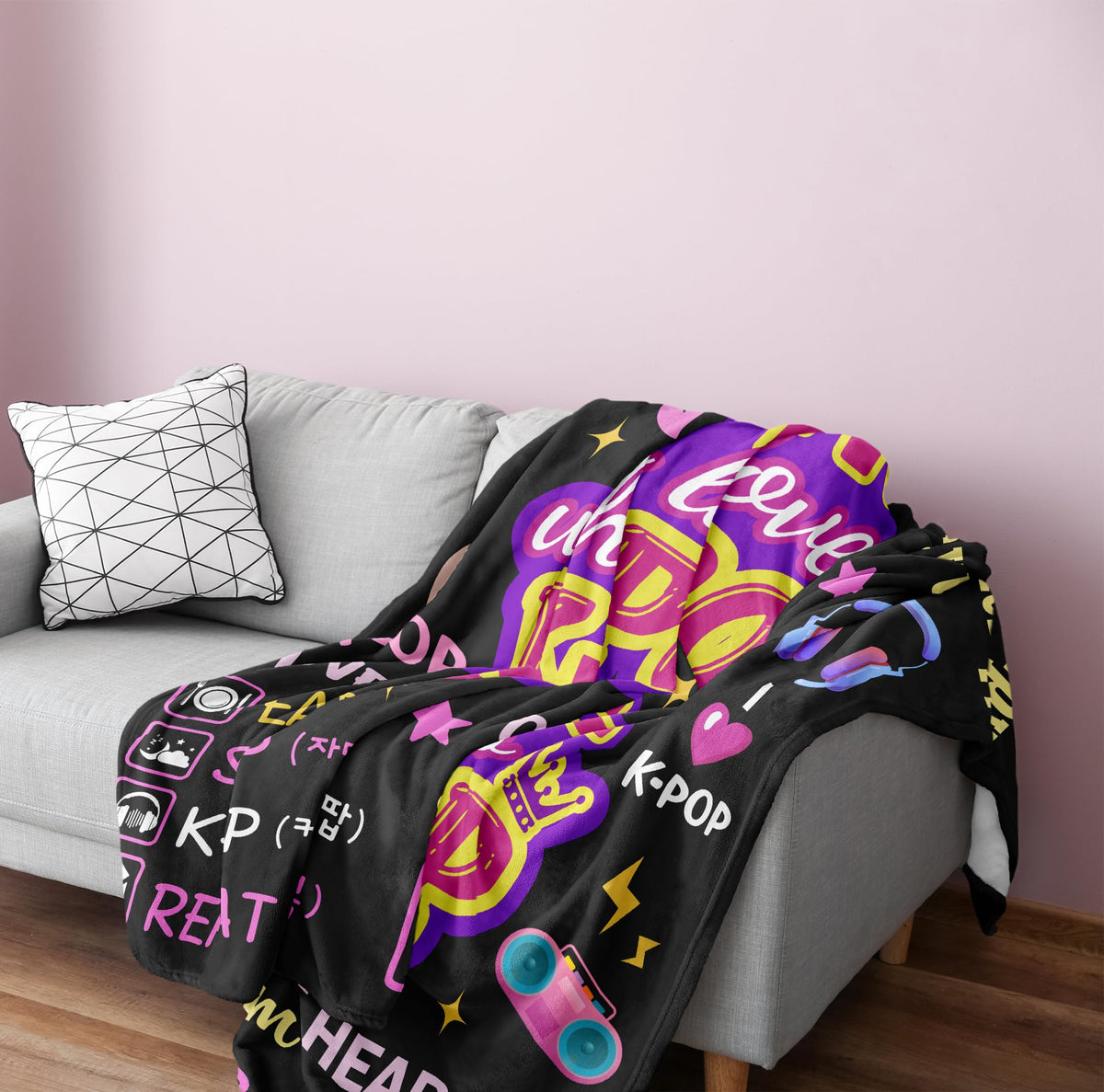 Turelos Kpop blanket invites cozy couch time during music sessions.