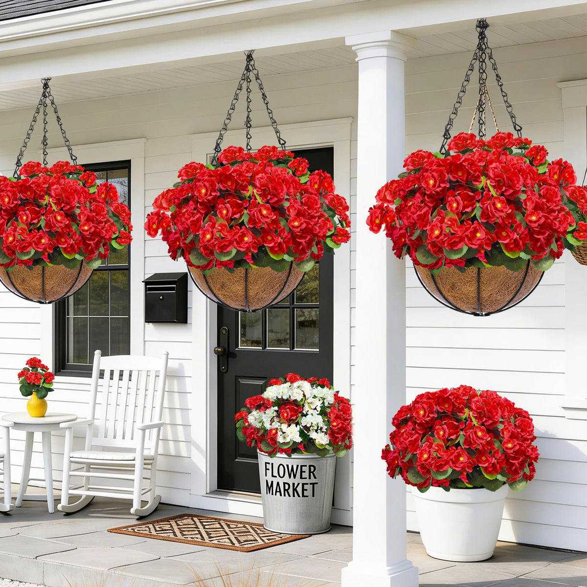 TURNMEON porch hanging display with red geraniums.