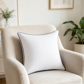 White Tusavi decorative pillows on a couch for modern styling