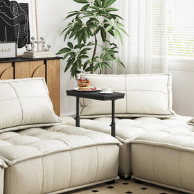 TUTOTAK side table in living room provides versatile surface for drinks and devices.