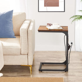TUTOTAK sofa-side table slides under the couch for convenient access.